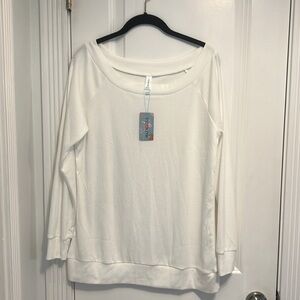 Women’s long sleeve white top. Size M